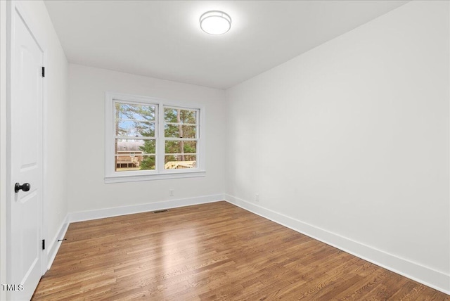 303 Forest Rd, Oxford, NC 27565 - unfurnished room featuring baseboards and light wood-style floors