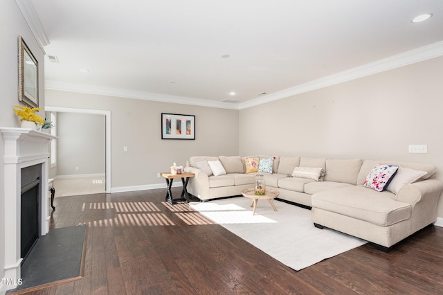 living room with dark hardwood / wood-style flooring and ornamental molding