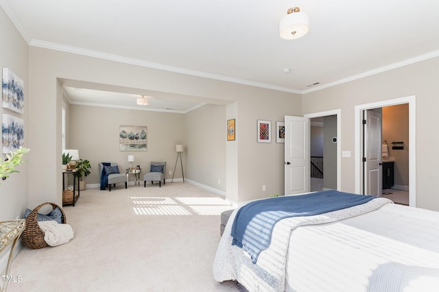 carpeted bedroom featuring ensuite bathroom and ornamental molding