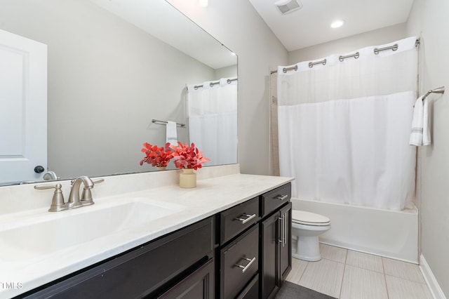 full bathroom featuring tile patterned floors, vanity, shower / tub combo, and toilet