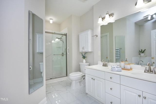 bathroom with an enclosed shower, vanity, and toilet