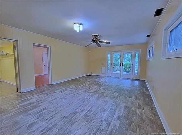 interior space featuring ceiling fan, hardwood / wood-style floors, and french doors