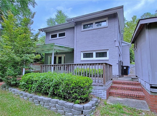 rear view of house with a porch