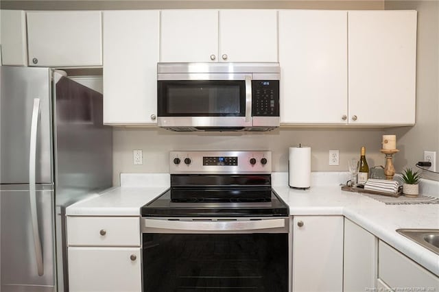 kitchen featuring white cabinets and stainless steel appliances