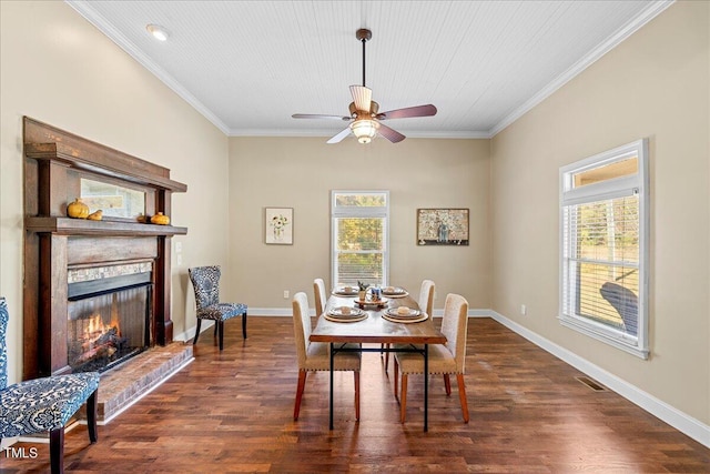 dining area featuring ornamental molding, ceiling fan, and dark hardwood / wood-style floors