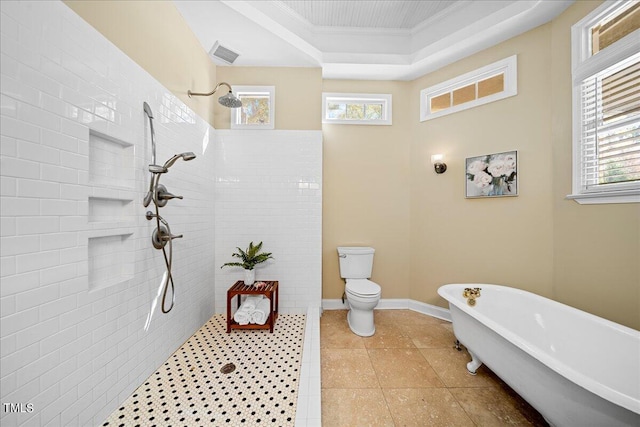 bathroom with a raised ceiling, ornamental molding, toilet, tile patterned floors, and plus walk in shower