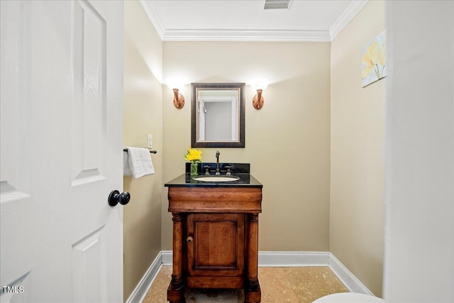 bathroom with crown molding and vanity