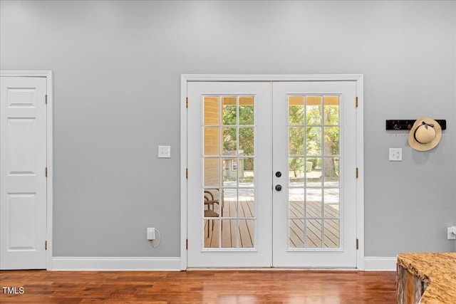 doorway to outside featuring french doors and wood-type flooring