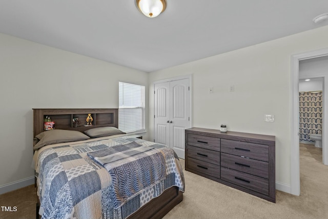 carpeted bedroom with a closet