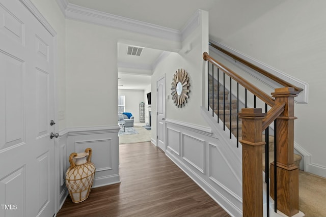 interior space featuring dark hardwood / wood-style flooring and crown molding