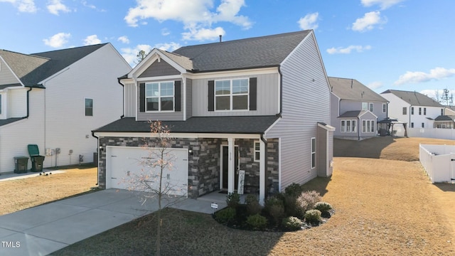 view of front of home with a front lawn and a garage