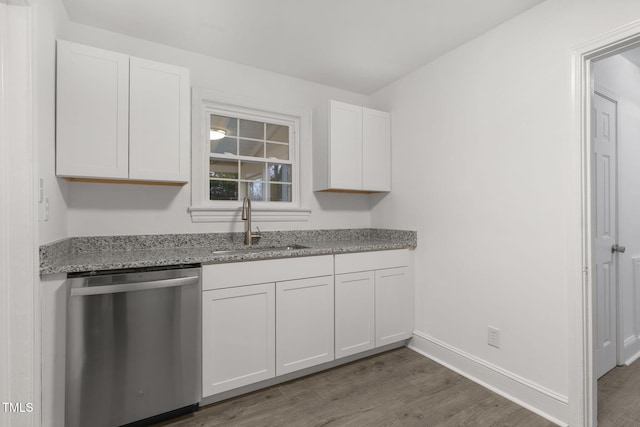 kitchen with dishwasher, wood-type flooring, white cabinetry, and sink