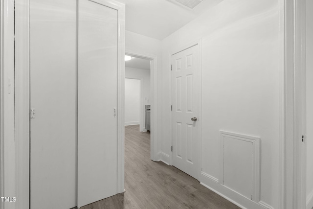 corridor featuring light wood-type flooring