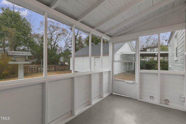 unfurnished sunroom with wood ceiling and lofted ceiling with beams