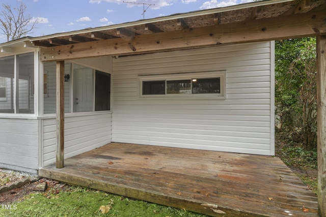 deck with a sunroom