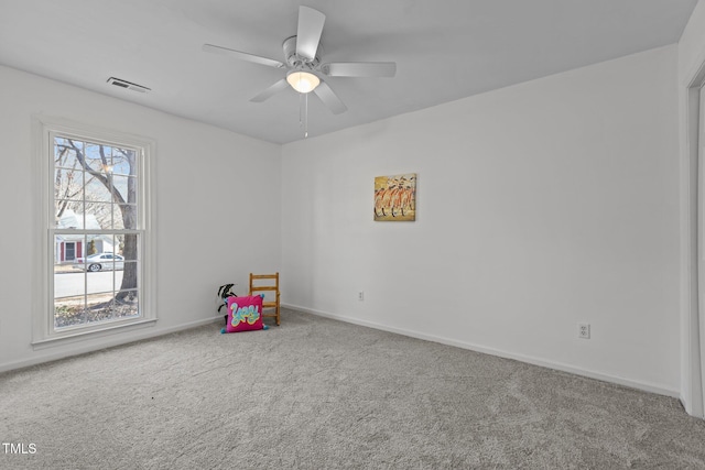 playroom with ceiling fan, a wealth of natural light, and carpet