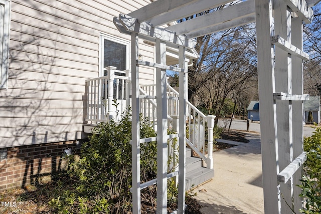 view of property exterior featuring a pergola