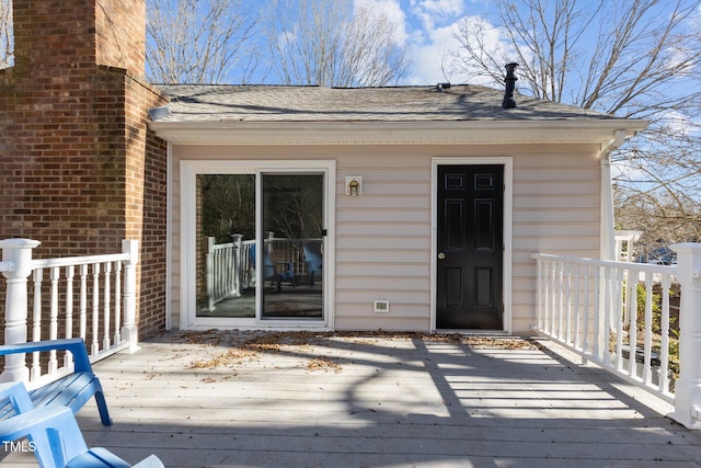 entrance to property with a wooden deck