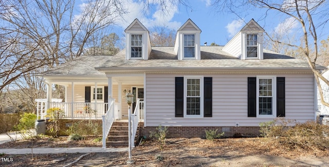 cape cod house with crawl space, a porch, and a shingled roof