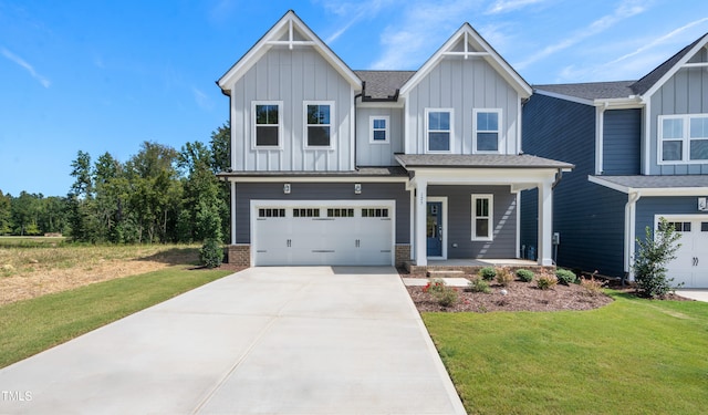 view of front facade with a garage and a front yard