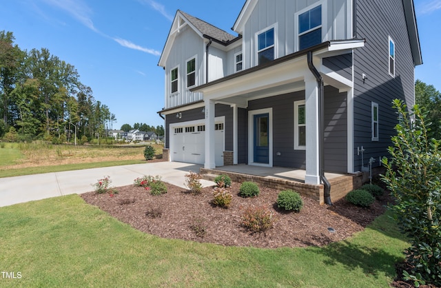 view of front of home featuring a porch and a garage