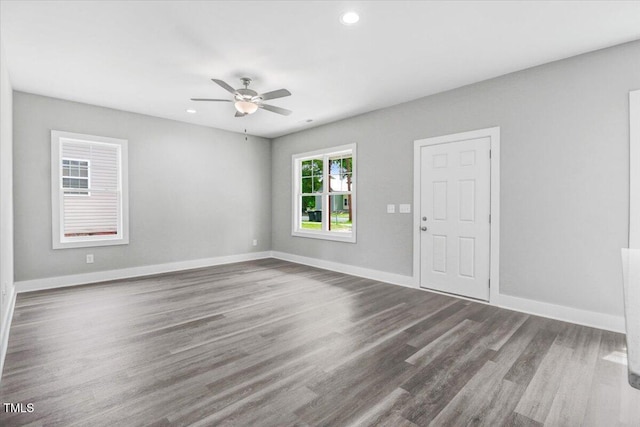 spare room featuring ceiling fan and hardwood / wood-style floors