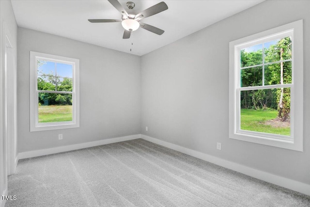 spare room with carpet and ceiling fan