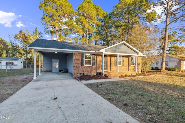 ranch-style home with a front lawn and a carport