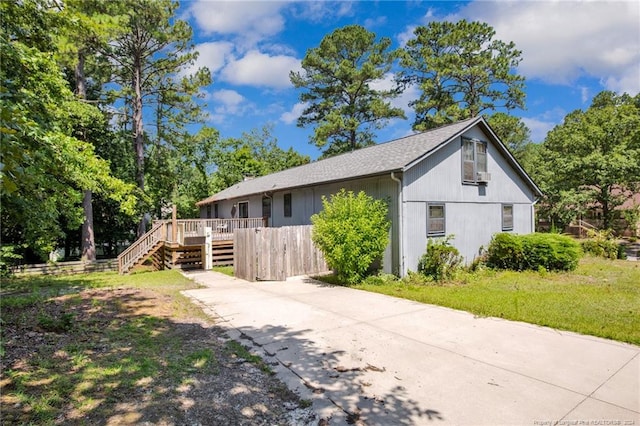 view of side of property featuring a deck