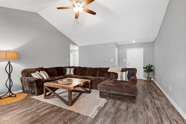 living room featuring ceiling fan, wood-type flooring, and lofted ceiling