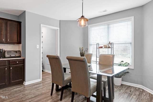 dining room featuring dark hardwood / wood-style flooring