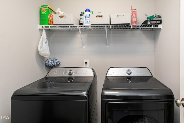 washroom with washer and dryer