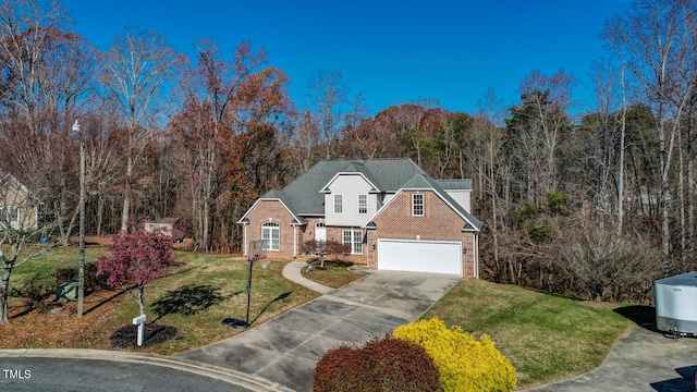 view of front of property featuring a garage and a front lawn