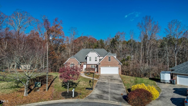 view of front property featuring a front lawn and a garage