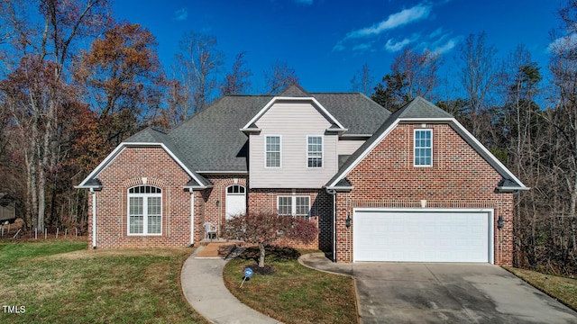 front of property featuring a garage and a front lawn