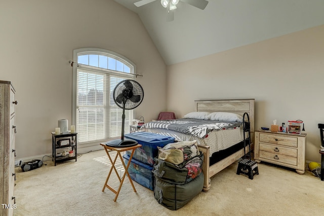 bedroom with carpet flooring, ceiling fan, and high vaulted ceiling