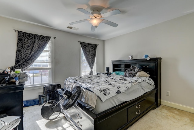 carpeted bedroom featuring ceiling fan