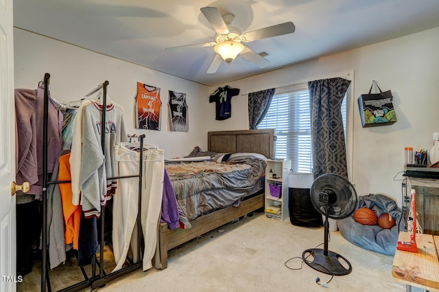 bedroom with ceiling fan and light carpet