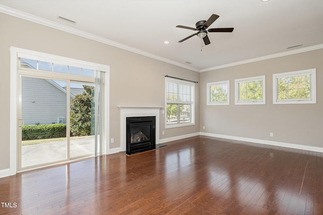 unfurnished living room featuring ceiling fan, dark hardwood / wood-style flooring, and ornamental molding