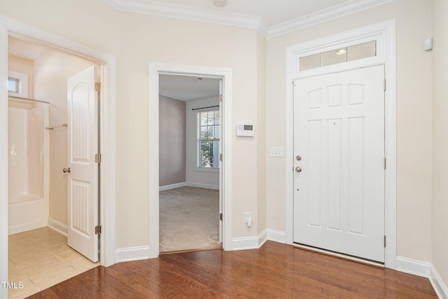 entrance foyer featuring hardwood / wood-style floors and ornamental molding