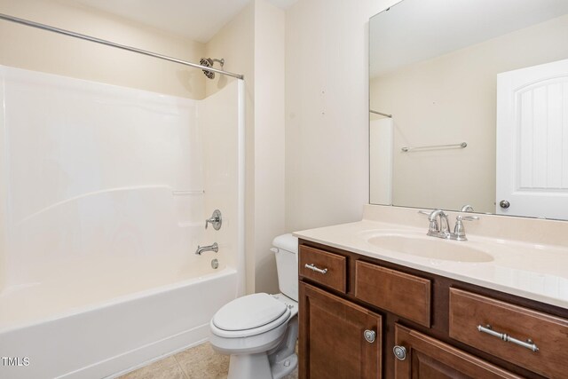 full bathroom with bathing tub / shower combination, tile patterned floors, vanity, and toilet