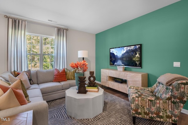 living room with dark hardwood / wood-style floors