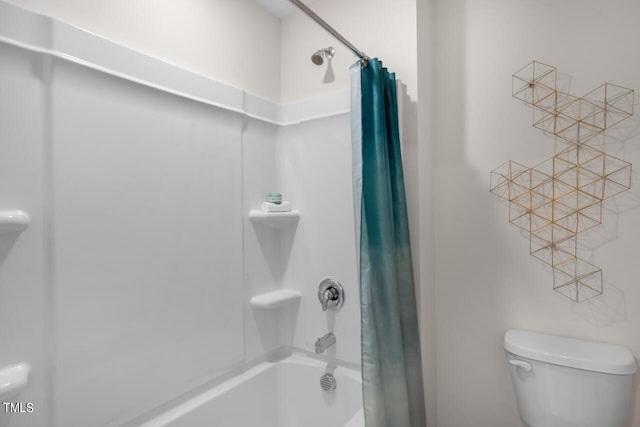 bathroom featuring shower / bath combination with curtain and toilet