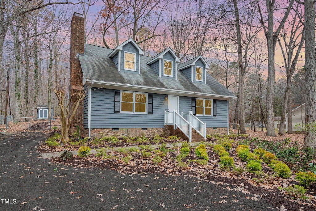 view of new england style home