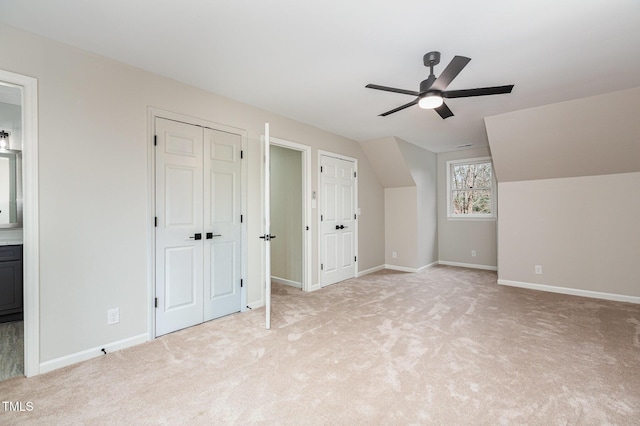 bonus room featuring ceiling fan, light carpet, and vaulted ceiling