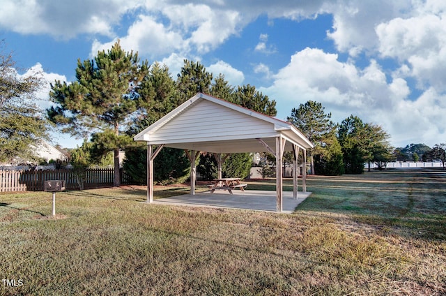 surrounding community featuring a gazebo, a yard, and fence