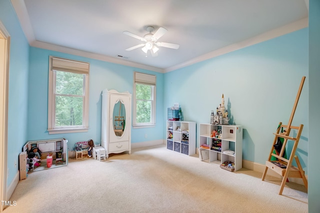 playroom featuring a wealth of natural light, carpet flooring, and ornamental molding