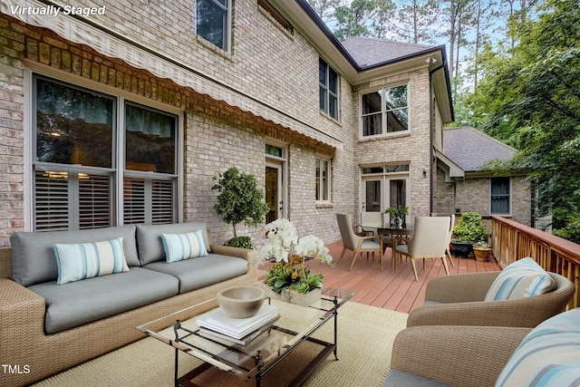 wooden deck featuring outdoor lounge area