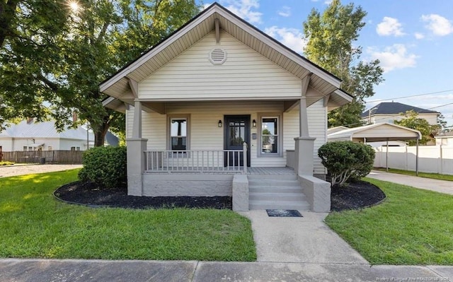 bungalow-style home featuring a front lawn and a porch