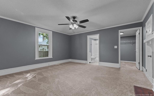 unfurnished bedroom with light carpet, a textured ceiling, ceiling fan, and a closet